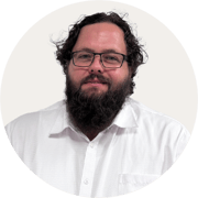 Mark_Carey_Profile image BACKGROUND COLOUR Warm Grey_ROUND_180 px x 180 px__RGB